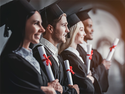 Students holding diplomas